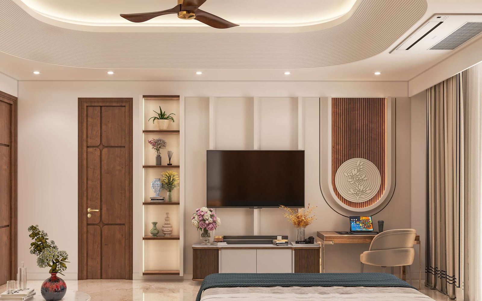 First bedroom at Anubhuti — media wall with fluted panelling, an arched slat feature with a carved medallion, and a lit display niche
